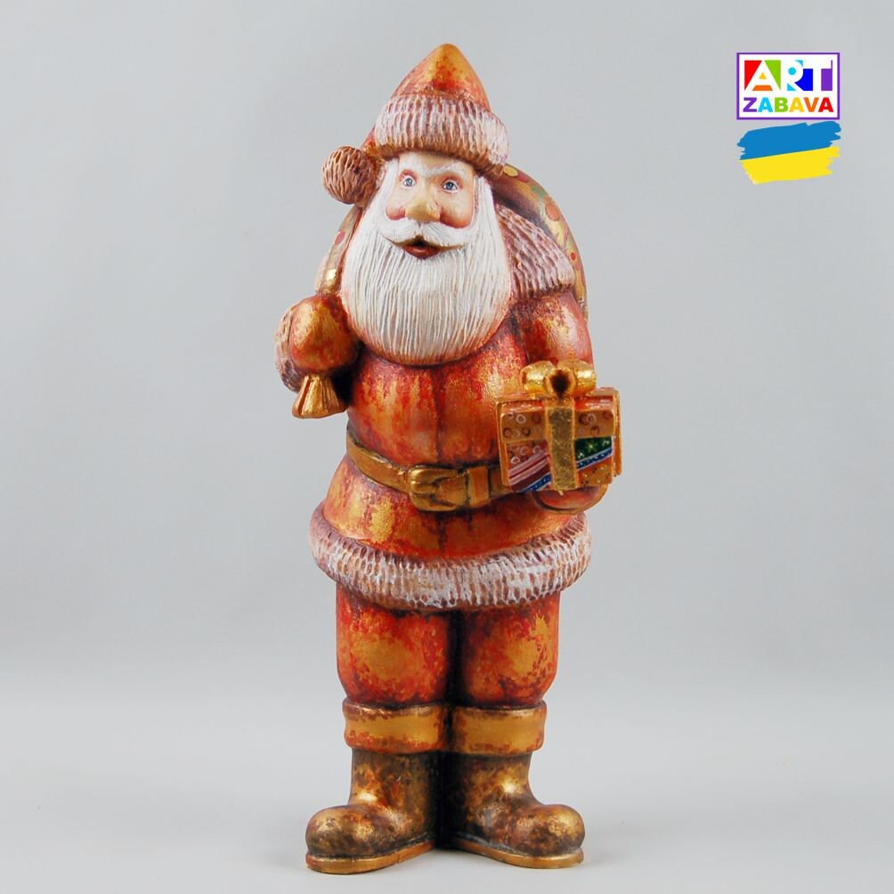 9.25-inch custom order hand-carved and painted Santa Claus wooden figurine with gift and bag, featuring detailed craftsmanship and Christmas design.